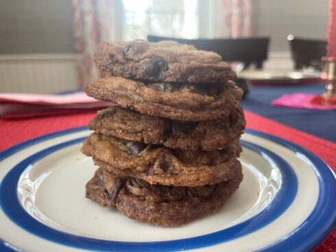 A stack of thin and crispy chocolate chip cookies